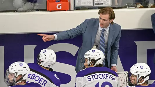 Castan Sommer on the bench at Holy Cross