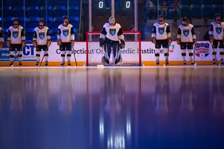 Felicia Frank and team before starting lineups vs Princeton (11.22.25 in Hamden, C.T.)