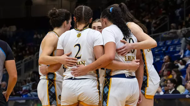 Women's Basketball Group Huddle