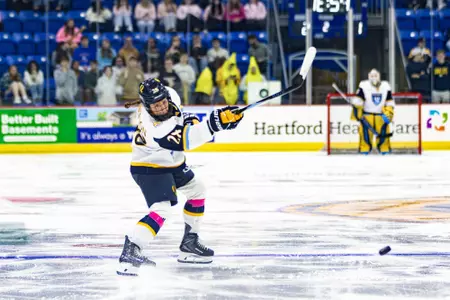 Makayla Watson shooting the puck against Northeastern (Oct. 16, 2026 in Hamden, CT)