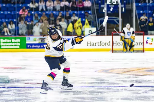 Makayla Watson shooting the puck against Northeastern (Oct. 16, 2026 in Hamden, CT)
