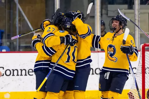 Group celebration after goal against Brown (Mar. 27, 2026 in Hamden, Conn.)