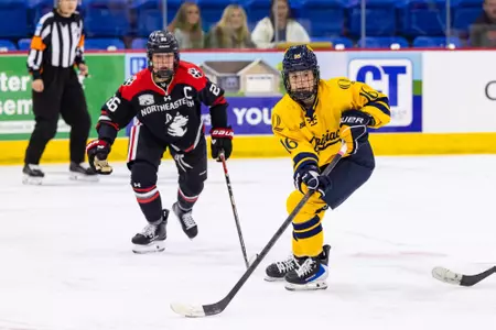 Bryn Prier skating with the puck against Northeastern (Oct. 17, 2026 in Hamden, CT)