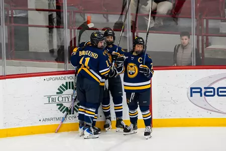 Avery Bairos celebrating with group after goal against RPI (Oct. 24, 2026 in Troy, NY)