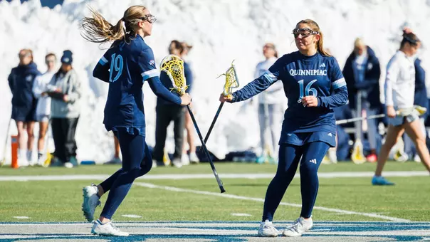 Kendall VanMeveren and Abby LoNigro Celebrate a Goal against UNH (Feb. 22, 2026 in Durham, N.H.)