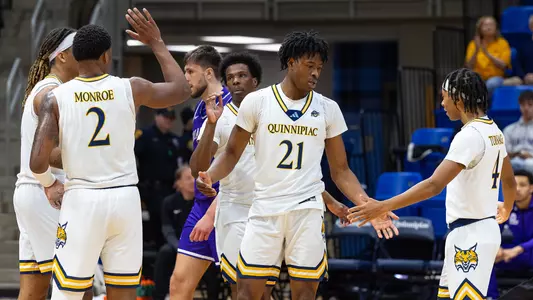 Keith McKnight Hi-Fives Teammates vs. Niagara (12/7/26 in Hamden, CT)