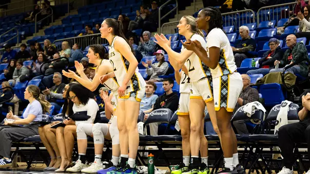 WBB Bench Celebrates in Win over Niagara (Feb. 26 in Hamden, Conn.)