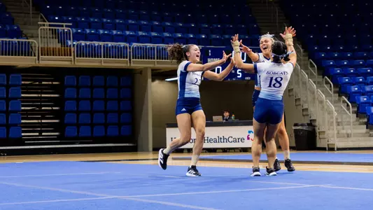 The Bobcats Celebrate After Their Trio Tumbling Pass