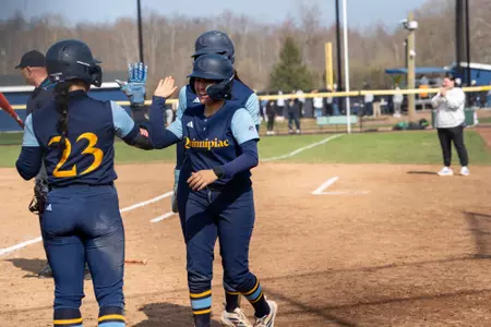 Natalia Apatiga and Ally Hochstatder Celebrating a Run Against Manhattan (April 3, 2026 in Hamden, Conn.)