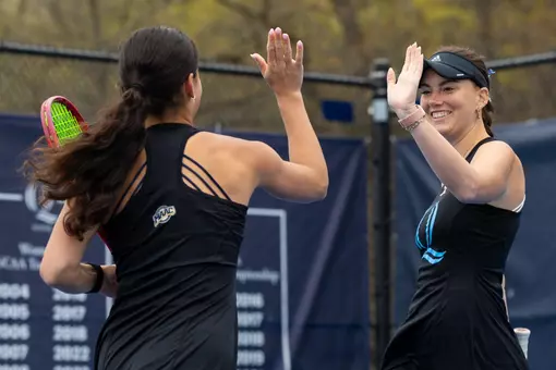 Caitlin Flower High Fiving Willow Renton in Doubles Play vs Niagara (April 18, 2026 in Hamden, Conn.)