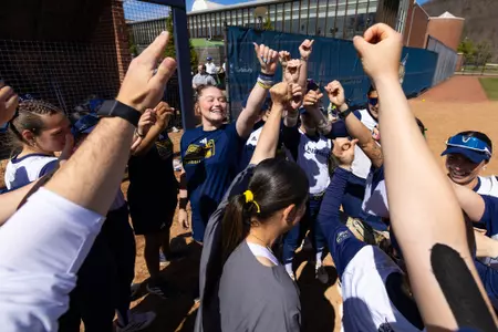 Softball Group Huddle Before Playing Manhattan (April 4, 2026)