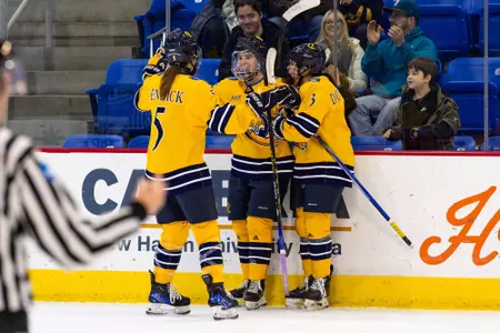 Kahlen Lamarche celebrating a goal with Aynsley D'Ottavio and Ella Sennick against Brown (Mar. 1, 2026 in Hamden, Conn.)
