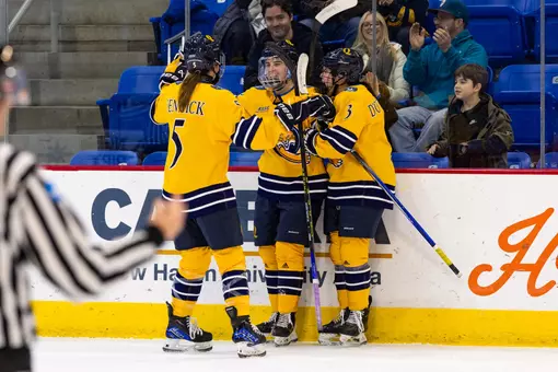 Kahlen Lamarche celebrating a goal with Aynsley D'Ottavio and Ella Sennick against Brown (Mar. 1, 2026 in Hamden, Conn.)