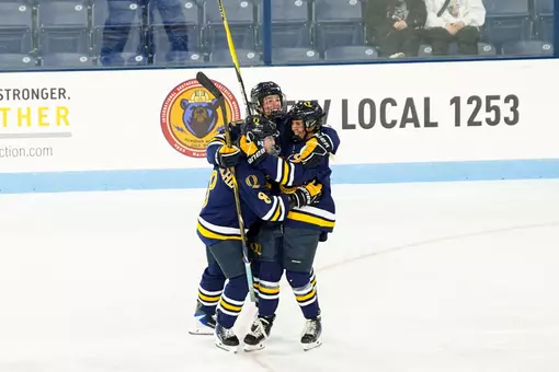 Alex Law celebrating with Kahlen Lamarche and Ella Sennick after goal against Maine (Sept. 25, 2026 in Orono, ME)