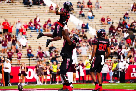 Nathan Thomas lifts up Zylan Perry after a touchdown October 7, 2023 Louisiana vs Texas State Football in Lafayette, LA at Cajun Field. Final score Louisiana 34 Texas State 30. Photo by Benjamin R. Massey/Ragin Cajun Athletics