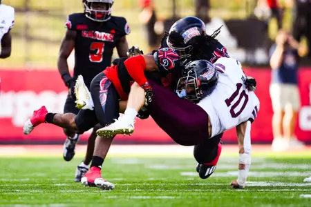 Keyon Martin makes a tackle October 7, 2023 Louisiana vs Texas State Football in Lafayette, LA at Cajun Field. Final score Louisiana 34 Texas State 30. Photo by Benjamin R. Massey/Ragin Cajun Athletics