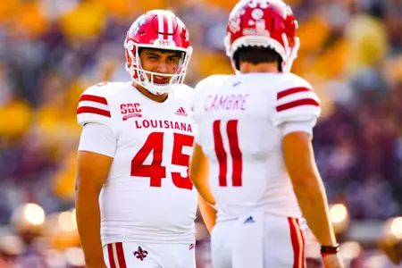Kenneth Almendares winks at Dalen Cambre after extra point September 30, 2023 Louisiana @ University of Minnesota Football in Minneapolis, MN at Huntington Bank Stadium. Final score Louisiana 24 Minnesota 35. Photo by Benjamin R. Massey/Ragin Cajun Athletics
