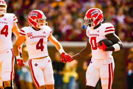 Jacob Kibodi and Jacob Bernard celebrate a touchdown September 30, 2023 Louisiana @ University of Minnesota Football in Minneapolis, MN at Huntington Bank Stadium. Final score Louisiana 24 Minnesota 35. Photo by Benjamin R. Massey/Ragin Cajun Athletics