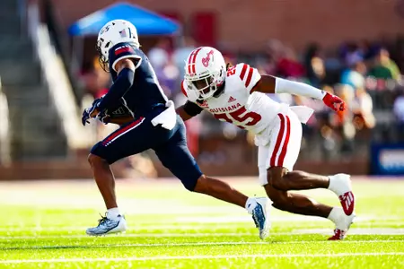 Glenn Brown makes a tackle October 28, 2023 Louisiana vs South Alabama Football in Mobile, AL at Hancock Whitney Bank Stadium. Final score Louisiana 33 South Alabama 20. Photo by Benjamin R. Massey/Ragin Cajun Athletics