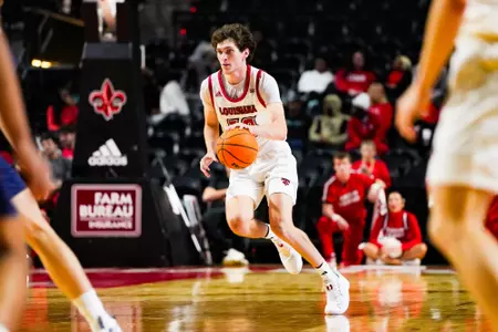 Christian Landry dribbles October 30, 2023 Louisiana vs University of Texas at Tyler Men's Basketball in Lafayette, LA at the Cajundome. Final score Louisiana 80 UT Tyler 57. Photo by Benjamin R. Massey/Ragin Cajun Athletics