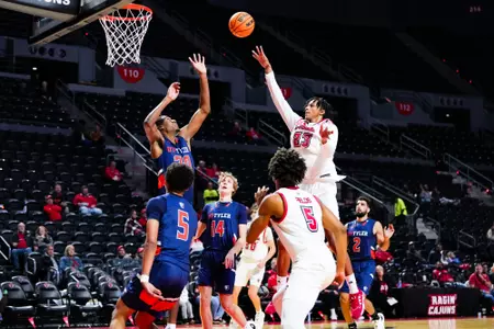 Kyran Ratliff shoots a floater October 30, 2023 Louisiana vs University of Texas at Tyler Men's Basketball in Lafayette, LA at the Cajundome. Final score Louisiana 80 UT Tyler 57. Photo by Benjamin R. Massey/Ragin Cajun Athletics