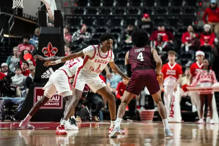 Joe Charles guards an EKU player