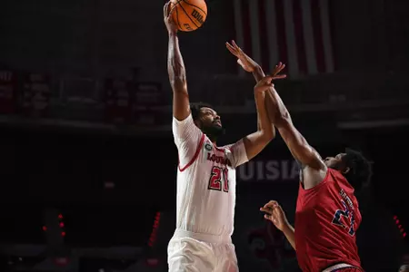Jordan Brown goes up with a hook shot over a defender