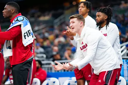 Vinny Sigona and the bench celebrates a made shot March 16, 2023. Louisiana vs Tennessee in the NCAA Tournament First Round at the Amway Center in Orlando, FL. Final score Louisiana 52 Tennessee 55. Photo by Benjamin R. Massey/Ragin Cajuns Athletics.