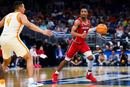 Themus Fulks dribbles the ball against Tennessee March 16, 2023. Louisiana vs Tennessee in the NCAA Tournament First Round at the Amway Center in Orlando, FL. Final score Louisiana 52 Tennessee 55. Photo by Benjamin R. Massey/Ragin Cajuns Athletics.