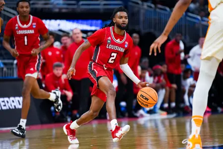 Michael Thomas dribbles the ball against Tennessee March 16, 2023. Louisiana vs Tennessee in the NCAA Tournament First Round at the Amway Center in Orlando, FL. Final score Louisiana 52 Tennessee 55. Photo by Benjamin R. Massey/Ragin Cajuns Athletics.