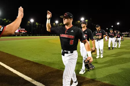 Heath Hood high fives post game April 29, 2023 Louisiana vs Coastal Carolina Baseball in Russo Park at M.L. "Tigue" Moore Field. Final Score Louisiana 3 CCU 5. Photo by Benjamin R. Massey/Ragin Cajun Athletics