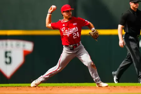 Kyle DeBarge fields a ball June 2, 2023 Louisiana vs Texas Baseball in the 2023 Coral Gables Regional Opening game at Alex Rodriguez Field in Miami, FL. Final Score Louisiana 2 Texas 4. Photo by Benjamin R. Massey/Ragin Cajun Athletics