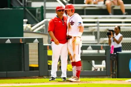 John Taylor talks to Matt Deggs June 3, 2023 Louisiana vs Maine Baseball in the 2023 Coral Gables Regional Elimaination Game at Alex Rodriguez Field in Miami, FL. Final Score Louisiana 19 Maine 10. Photo by Benjamin R. Massey/Ragin Cajun Athletics