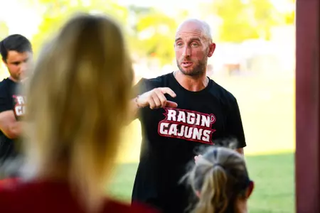 Chris McBride talks to the team post game August 14, 2023 Louisiana Women's Soccer @ Northwestern State in Nachitoches, LA. Final Score Louisiana 1 NWSU 0. Photo by Benjamin R. Massey/Ragin Cajun Athletics