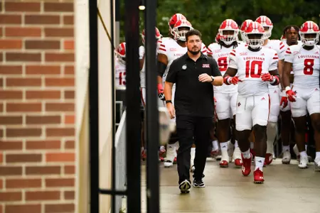 Assistant Director of Athletic Performance for Football, Chandler Wachholtz leads team down to the field September 9, 2023 Louisiana @ Old Dominion University Football in Northfolk, VA at S.B. Ballard Stadium. Final score Louisiana 31 ODU 38. Photo by Benjamin R. Massey/Ragin Cajun Athletics