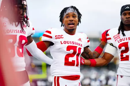 Keyon Martin talks in pregame huddle September 9, 2023 Louisiana @ Old Dominion University Football in Northfolk, VA at S.B. Ballard Stadium. Final score Louisiana 31 ODU 38. Photo by Benjamin R. Massey/Ragin Cajun Athletics