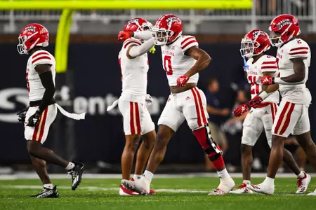 Jordan Lawson and Courtline Flowers celebrates a tackle September 9, 2023 Louisiana @ Old Dominion University Football in Northfolk, VA at S.B. Ballard Stadium. Final score Louisiana 31 ODU 38. Photo by Benjamin R. Massey/Ragin Cajun Athletics
