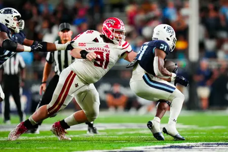 Sonny Hazard makes a tackle September 9, 2023 Louisiana @ Old Dominion University Football in Northfolk, VA at S.B. Ballard Stadium. Final score Louisiana 31 ODU 38. Photo by Benjamin R. Massey/Ragin Cajun Athletics