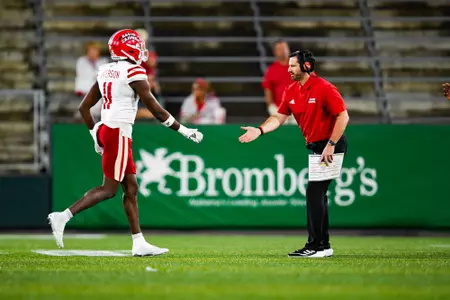 Head Coach, Michael Desormeaux high fives Caleb Anderson September 16, 2023 Louisiana vs University of Alabama Birmingham Football in Birmingham, AL at Protective Stadium. Final score Louisiana 41 UAB 21. Photo by Benjamin R. Massey/Ragin Cajun Athletics