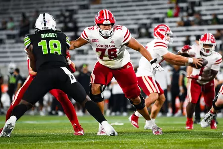 Quinton Williams makes a block September 16, 2023 Louisiana vs University of Alabama Birmingham Football in Birmingham, AL at Protective Stadium. Final score Louisiana 41 UAB 21. Photo by Benjamin R. Massey/Ragin Cajun Athletics