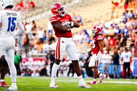Cameron Whitfield celebrates a tackle September 23, 2023 Louisiana vs University of Buffalo Football in Lafayette, LA at Cajun Field. Final score Louisiana 45 Buffalo 38. Photo by Benjamin R. Massey/Ragin Cajun Athletics