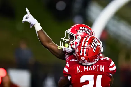 Patrick Mensah celebrates interception for a touchdown with Keyon Martin September 23, 2023 Louisiana vs University of Buffalo Football in Lafayette, LA at Cajun Field. Final score Louisiana 45 Buffalo 38. Photo by Benjamin R. Massey/Ragin Cajun Athletics
