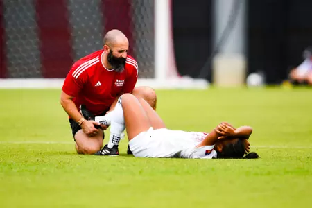 Eddie Avak helps an injured player September 24, 2023 Louisiana Women's Soccer vs Louisiana-Monroe in Lafayette, LA at Home Bank Track and Soccer Complex. Final Score Louisiana 0 ULM 1. Photo by Benjamin R. Massey/Ragin Cajun Athletics