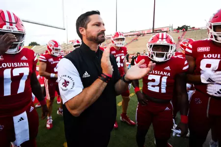 Head Coach, Michael Desormeaux talks in team huddle September 2, 2023 Louisiana vs Northwestern State Football in Lafayette, LA at Cajun Field. Final score Louisiana 38 NSU 13. Photo by Benjamin R. Massey/Ragin Cajun Athletics