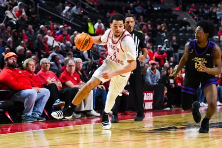Kobe Julien dribbles January 19, 2024 Louisiana vs James Madison University Men's Basketball in Lafayette, LA at the Cajundome. Final score Louisiana 61 JMU 68. Photo by Benjamin R. Massey/Ragin Cajun Athletics
