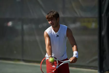 Samuel Kyjaci preparing to serve