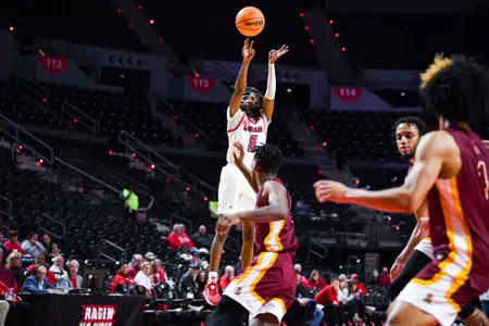 Michael Thomas shoots November 27, 2023 Louisiana vs Loyola New Orleans Men's Basketball in Lafayette, LA at the Cajundome. Final score Louisiana 78 Loyola NO 54. Photo by Benjamin R. Massey/Ragin Cajun Athletics