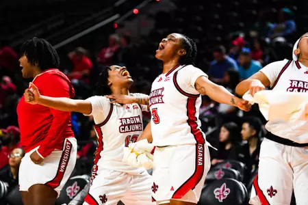 Tamiah Robinson and Nubia Benedith celebrate on the bench January 25, 2024 Louisiana vs Coastal Carolina Women's Basketball in Lafayette, LA at the Cajundome. Final score Louisiana 67 CCU 51. Photo by Benjamin R. Massey/Ragin Cajun Athletics