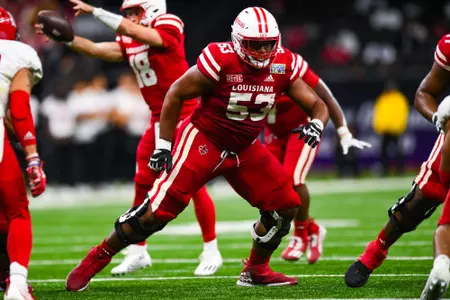 AJ Gillie makes a block December 16, 2023 Louisiana vs Jacksonville State Football in New Orleans, LA for the R.L. Carriers New Orleans Bowl at Ceasars New Orleans Superdome. Final score Louisiana #31 Jacksonville State 34. Photo by Benjamin R. Massey/Ragin Cajun Athletics