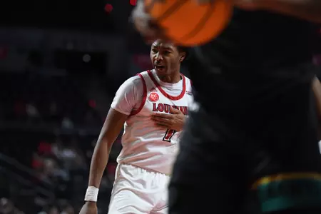 Joe Charles celebrates after a basket against Coastal Carolina